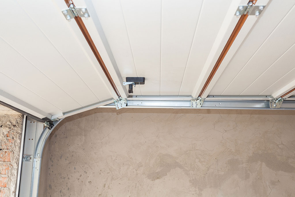 how to repair a bent garage door panel
